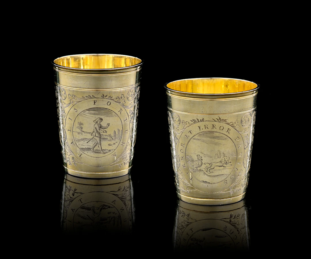 A pair of German silver-gilt beakers, Paul Solanier, Augsburg, 1697-1699