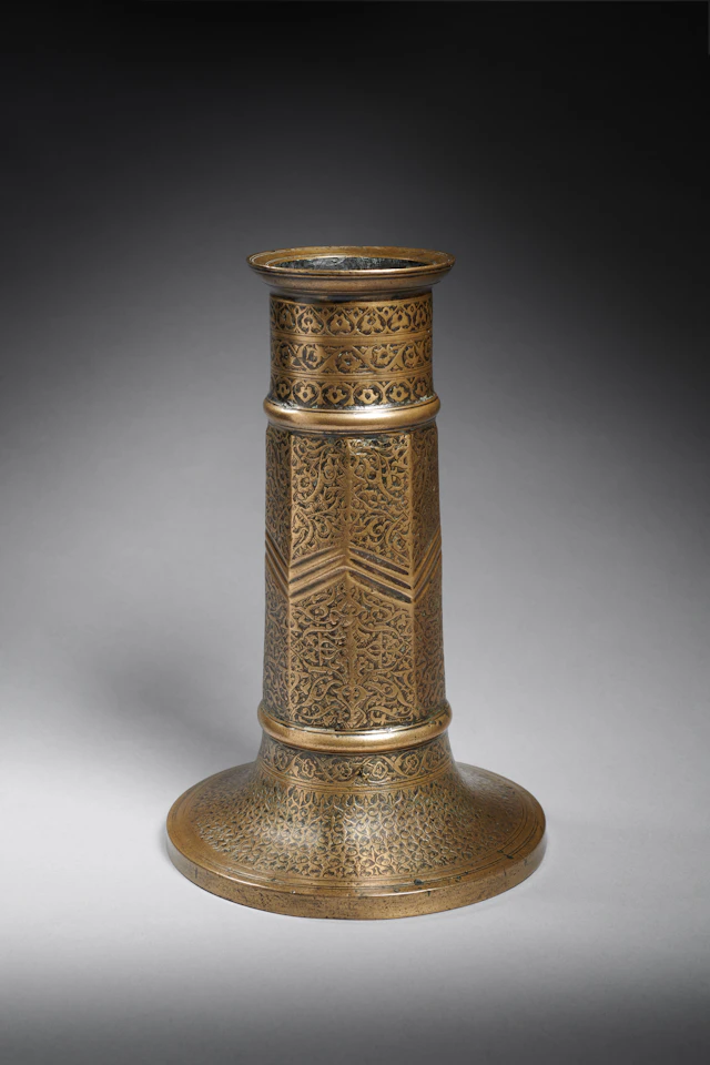 A Safavid Engraved Brass Candlestick (Sham’adan)