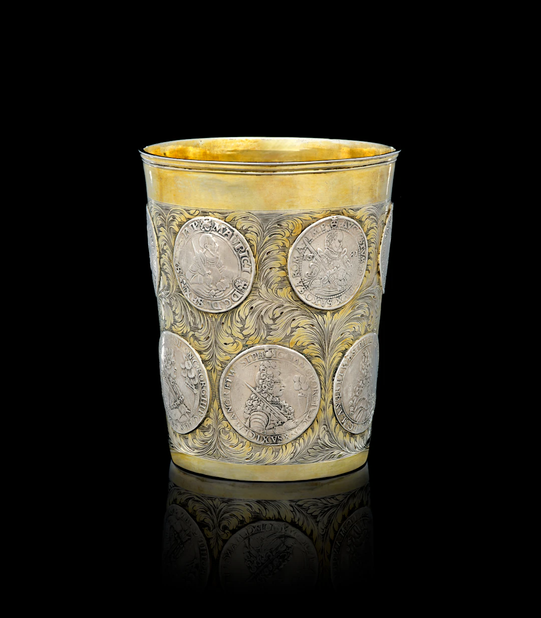 A large German parcel-gilt silver coin beaker, unidentified maker