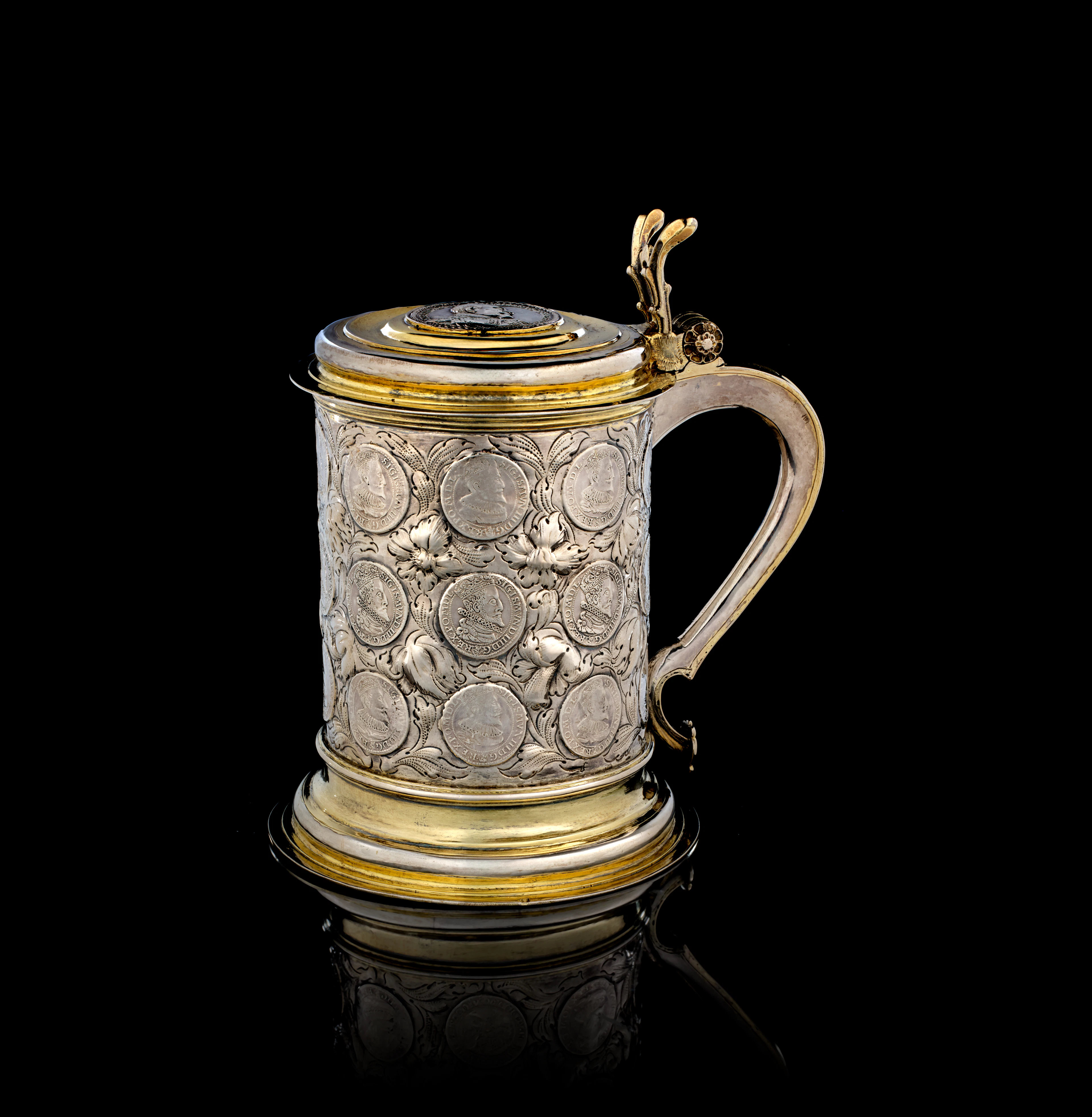 A large Russian parcel-gilt silver covered tankard with coins, David