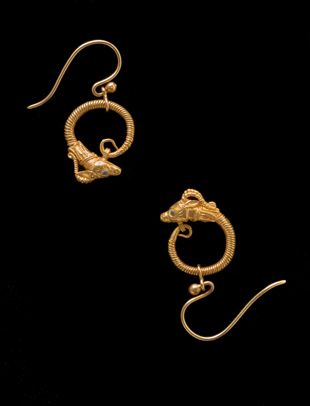 A Hellenistic pair of gold earring with antelope heads