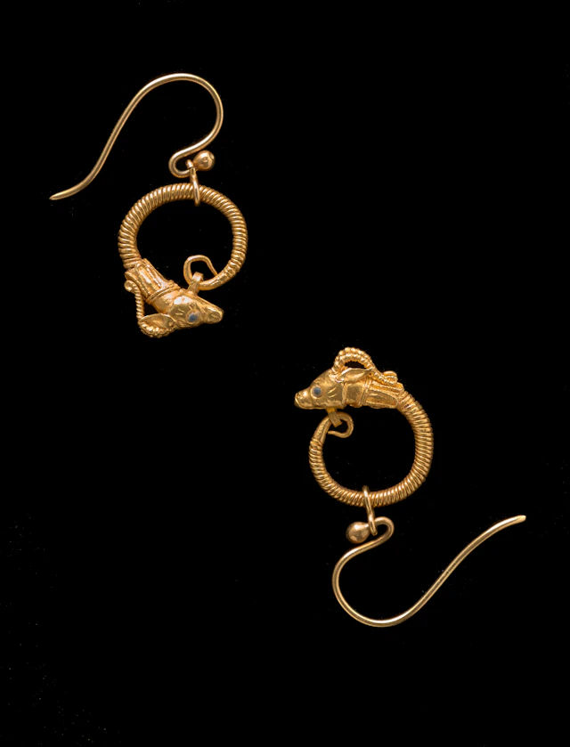 A Hellenistic pair of gold earring with antelope heads