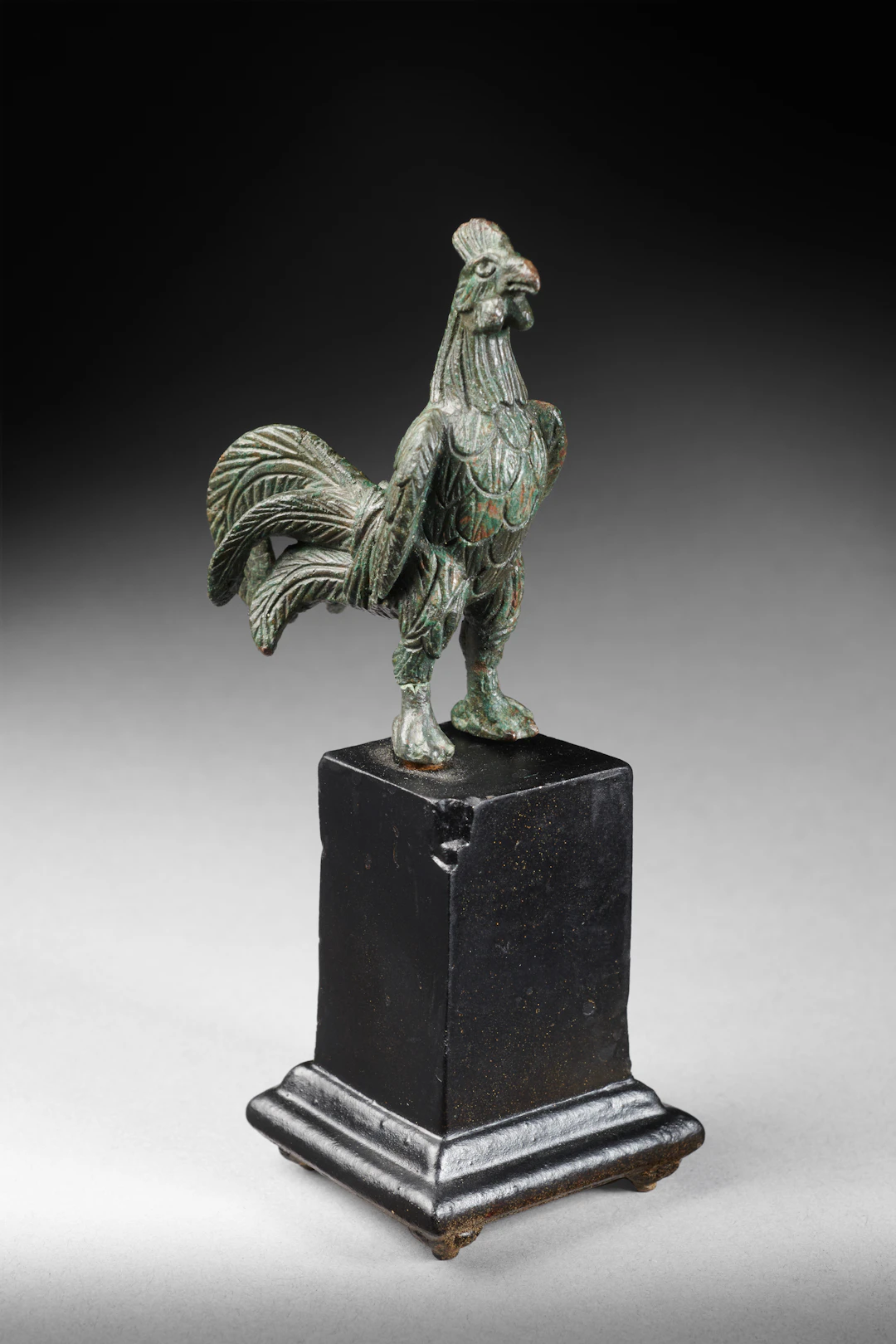A Roman bronze standing cockerel