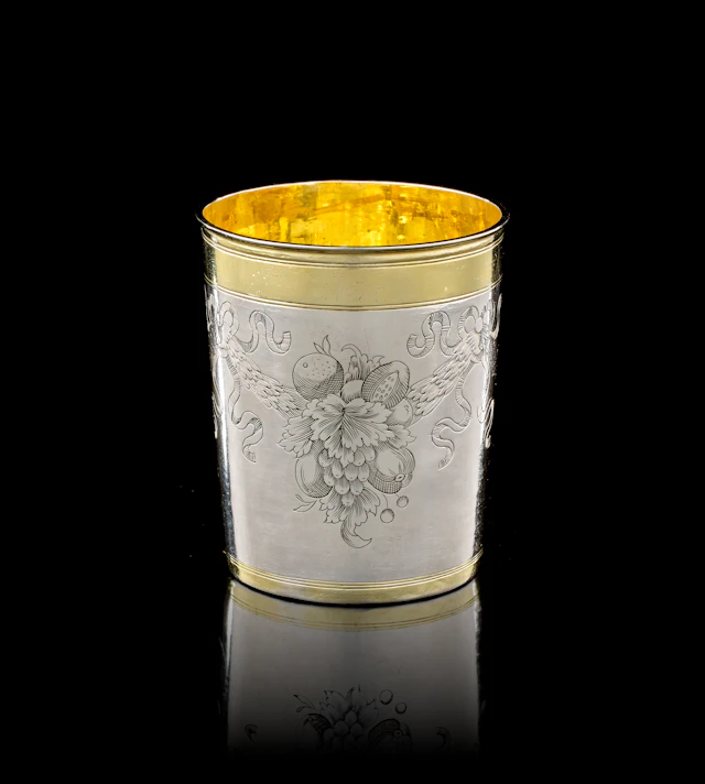 A German parcel-gilt silver beaker, Jacob Pfaff, Nuremberg, 1705-1706