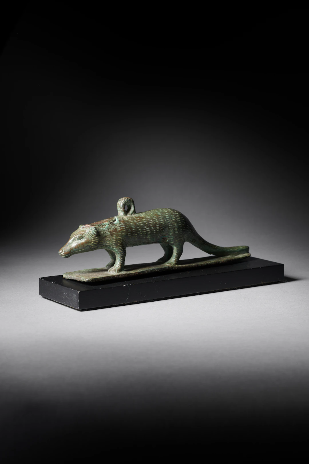 An Egyptian bronze figure of a Mangoose or Ichneumon