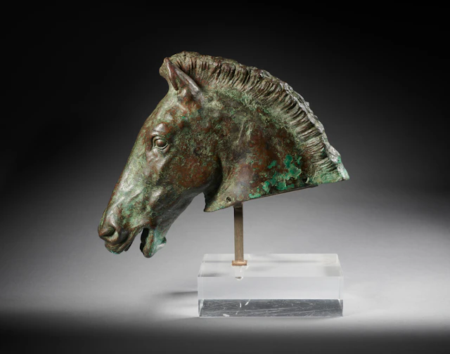 A Greek or Hellenistic bronze head of a horse