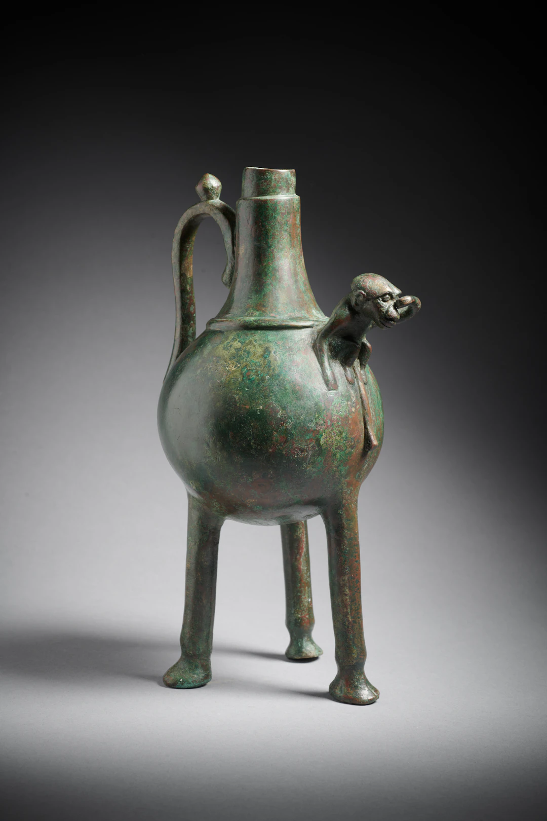 A Western Asiatic bronze vase with a monkey