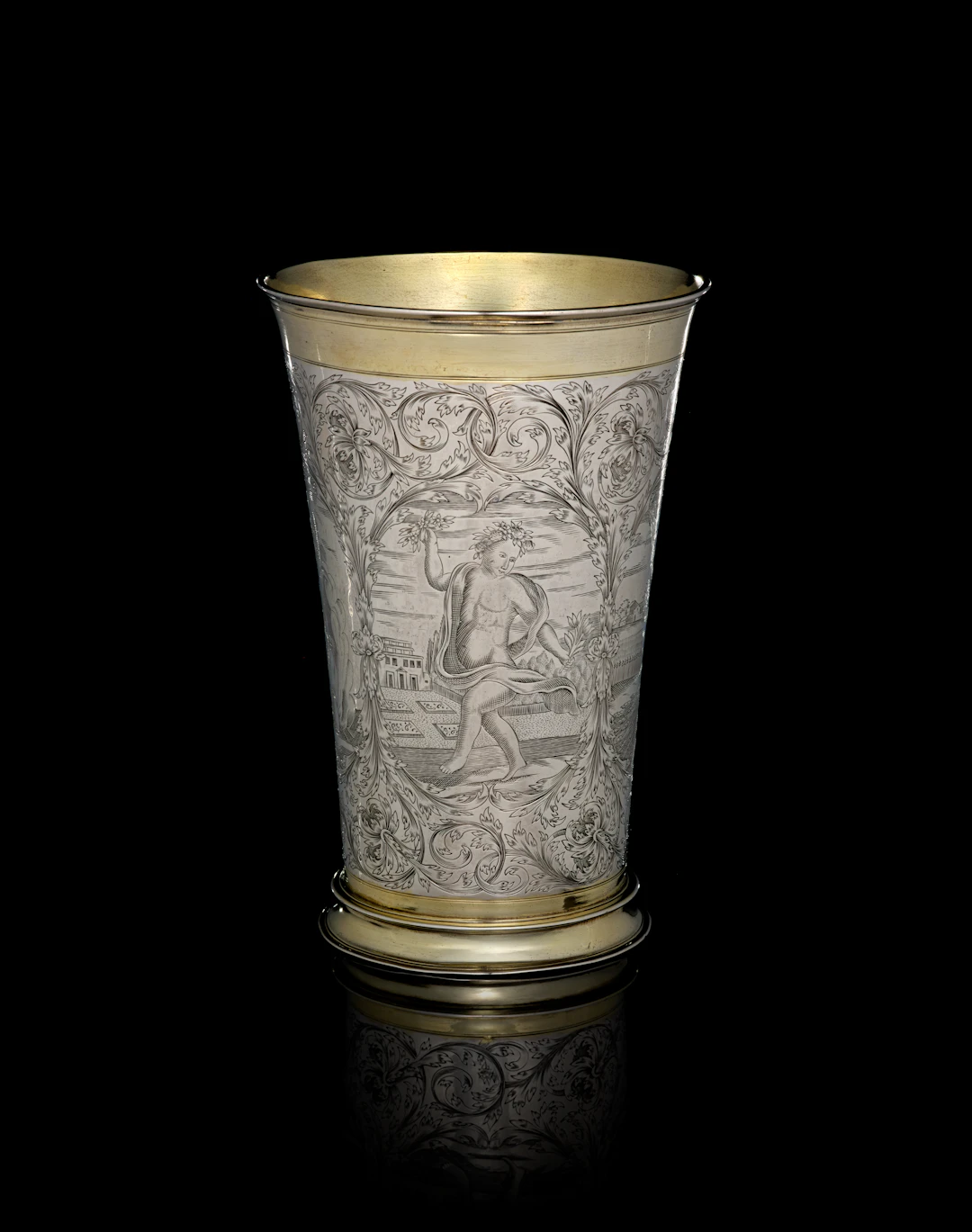 A large German parcel-gilt silver beaker depicting the Four Seasons
