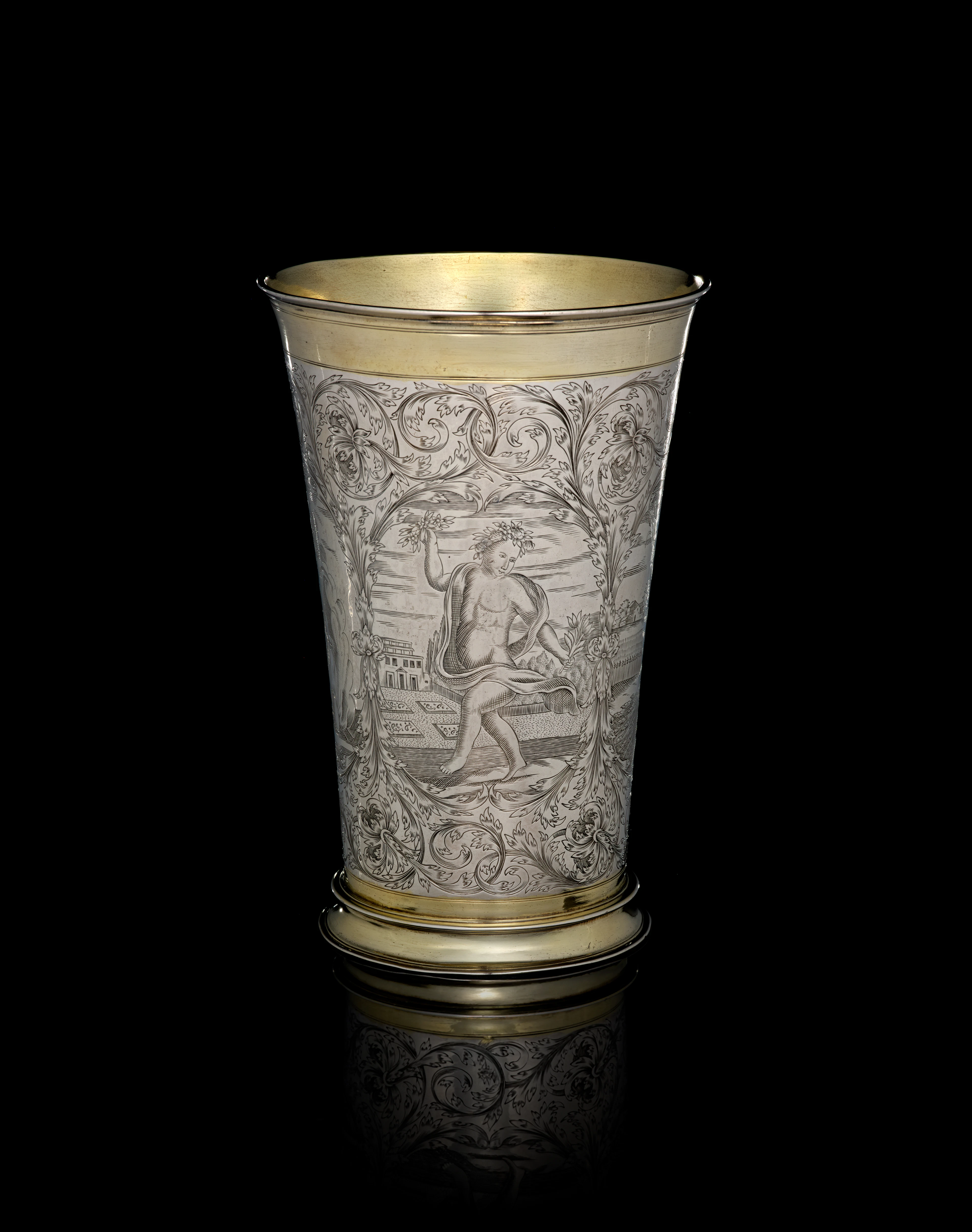A large German parcel-gilt silver beaker depicting the Four Seasons