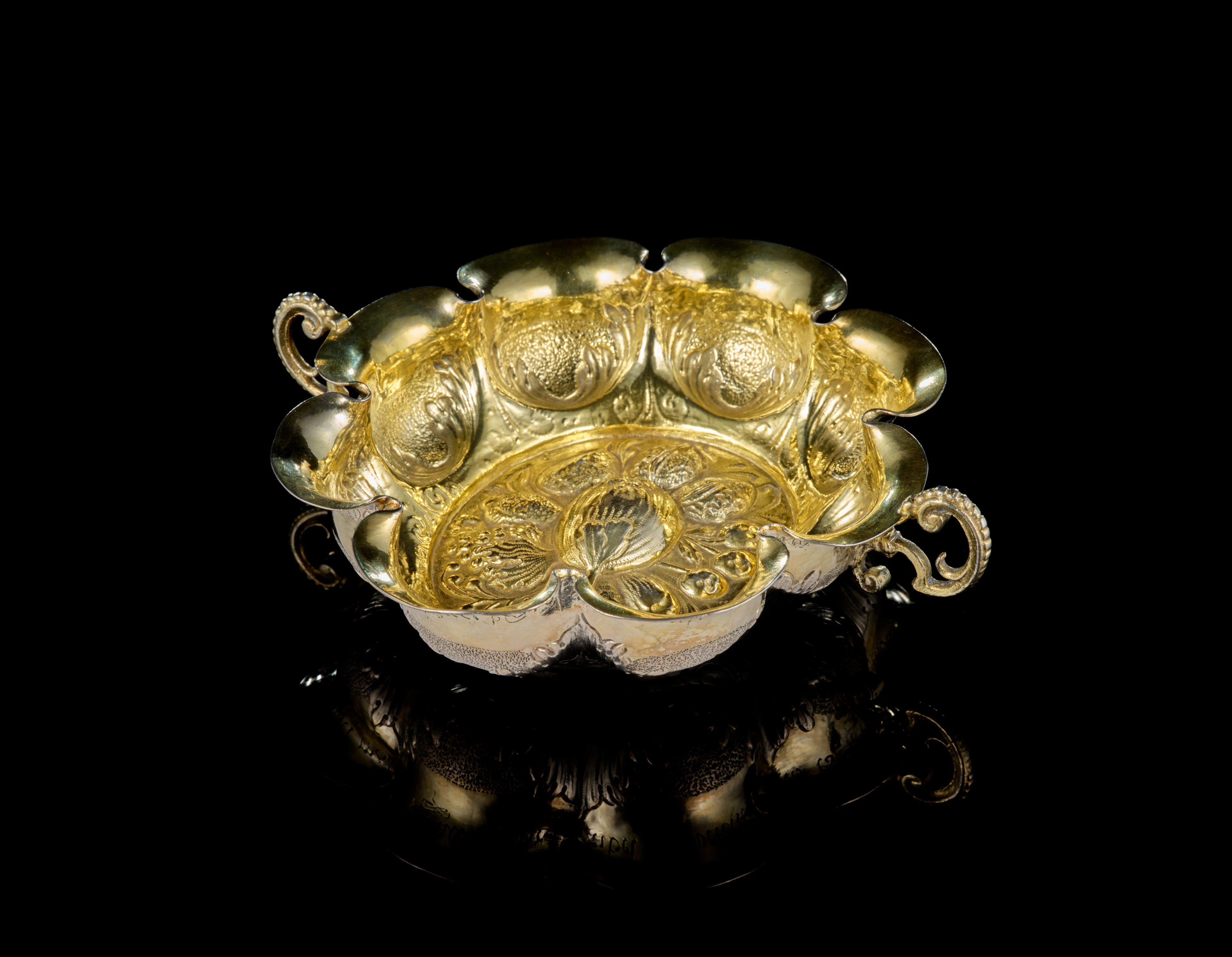 A Swiss parcel-gilt silver wine-taster, Heinrich Trachsel, Burgdorf, 1682