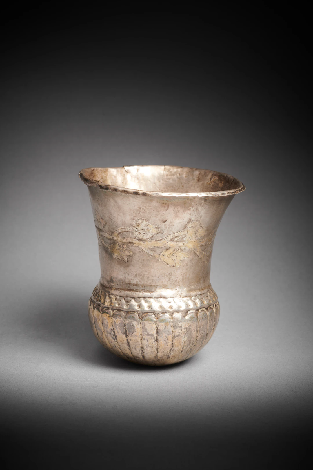 A Hellenistic parcel-gilt silver beaker