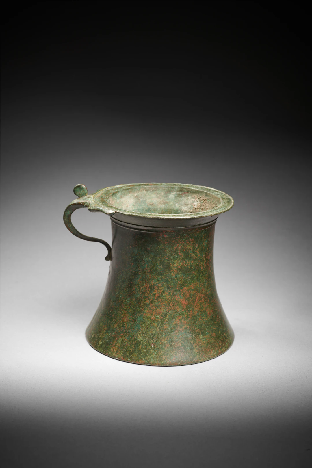 A Roman bronze tankard