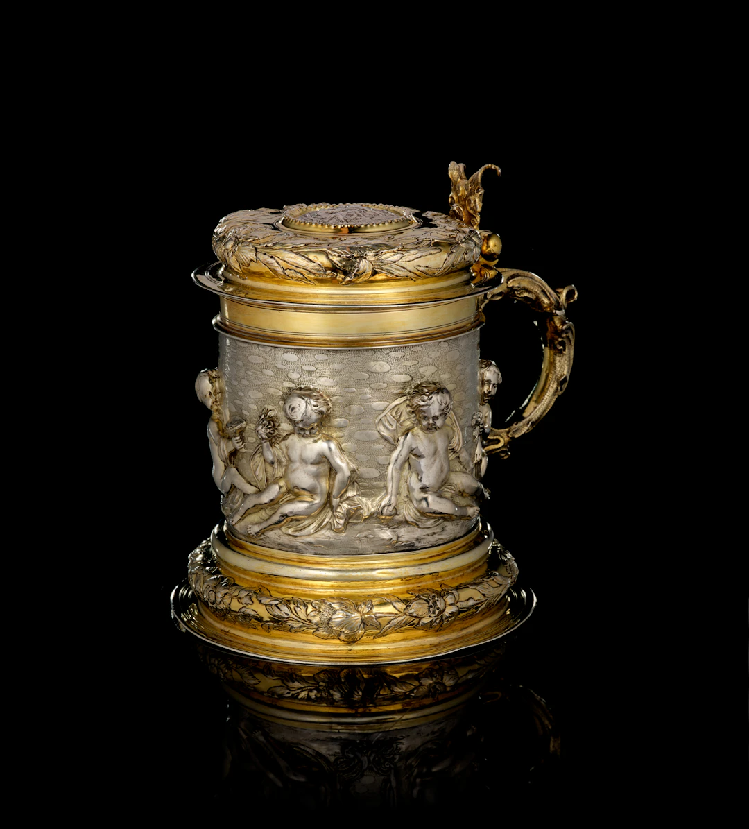 A German large parcel-gilt silver covered tankard, by Johann Brockmer
