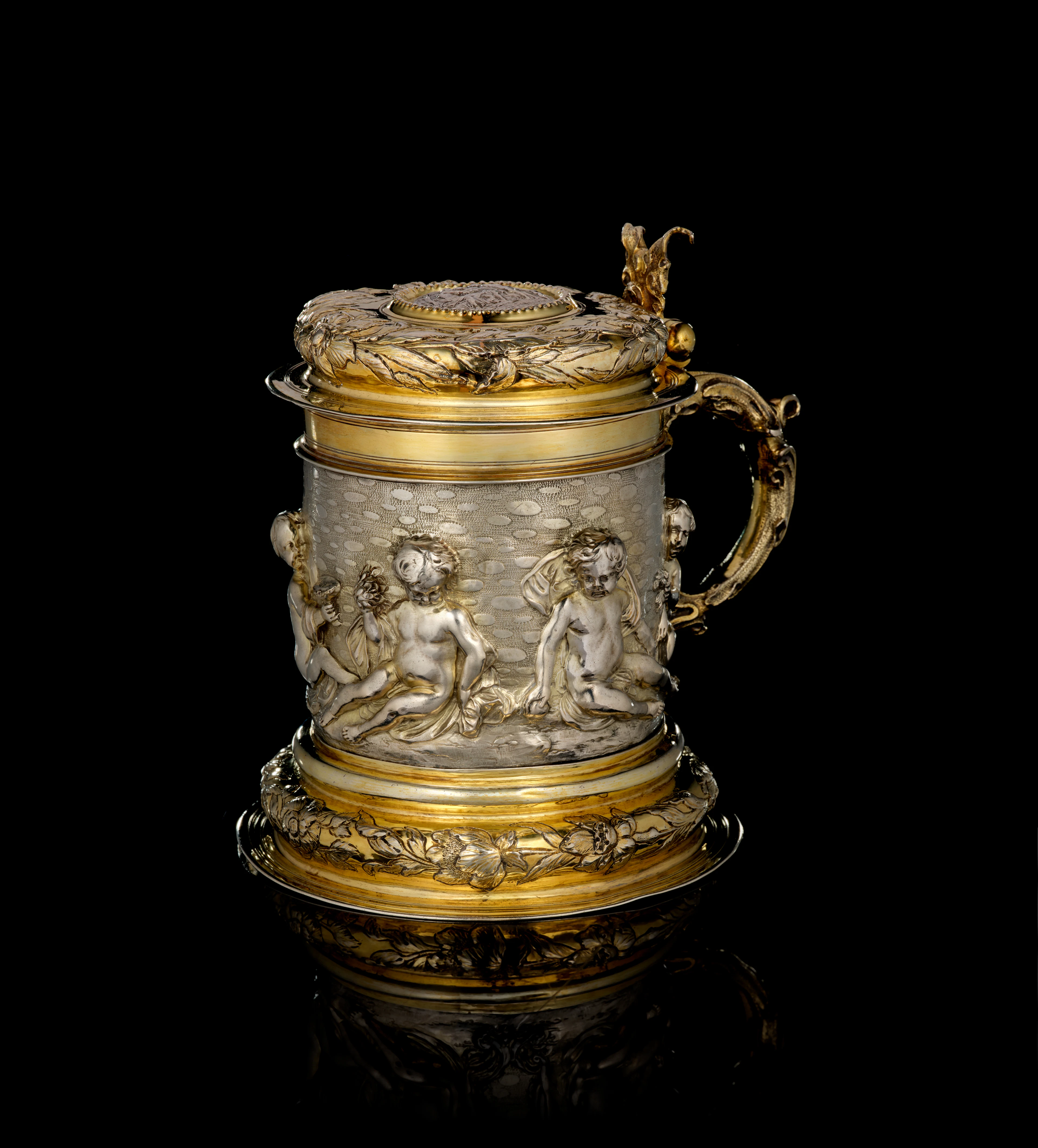 A German large parcel-gilt silver covered tankard, by Johann Brockmer