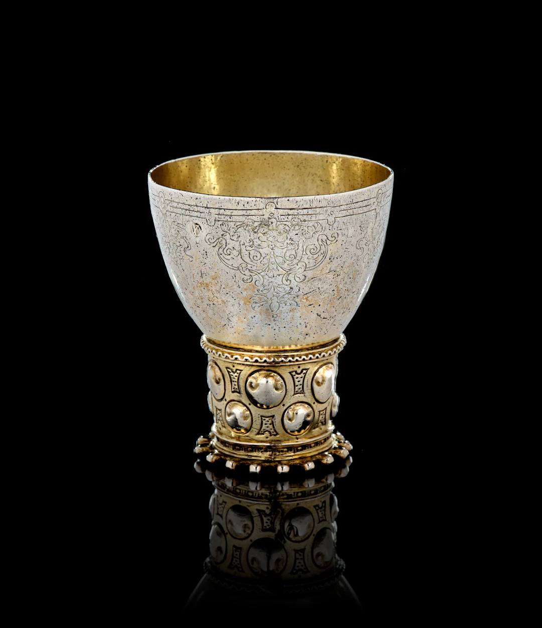A German parcel-gilt silver römer beaker, Isack de Voeghelaer, Emden, 1610