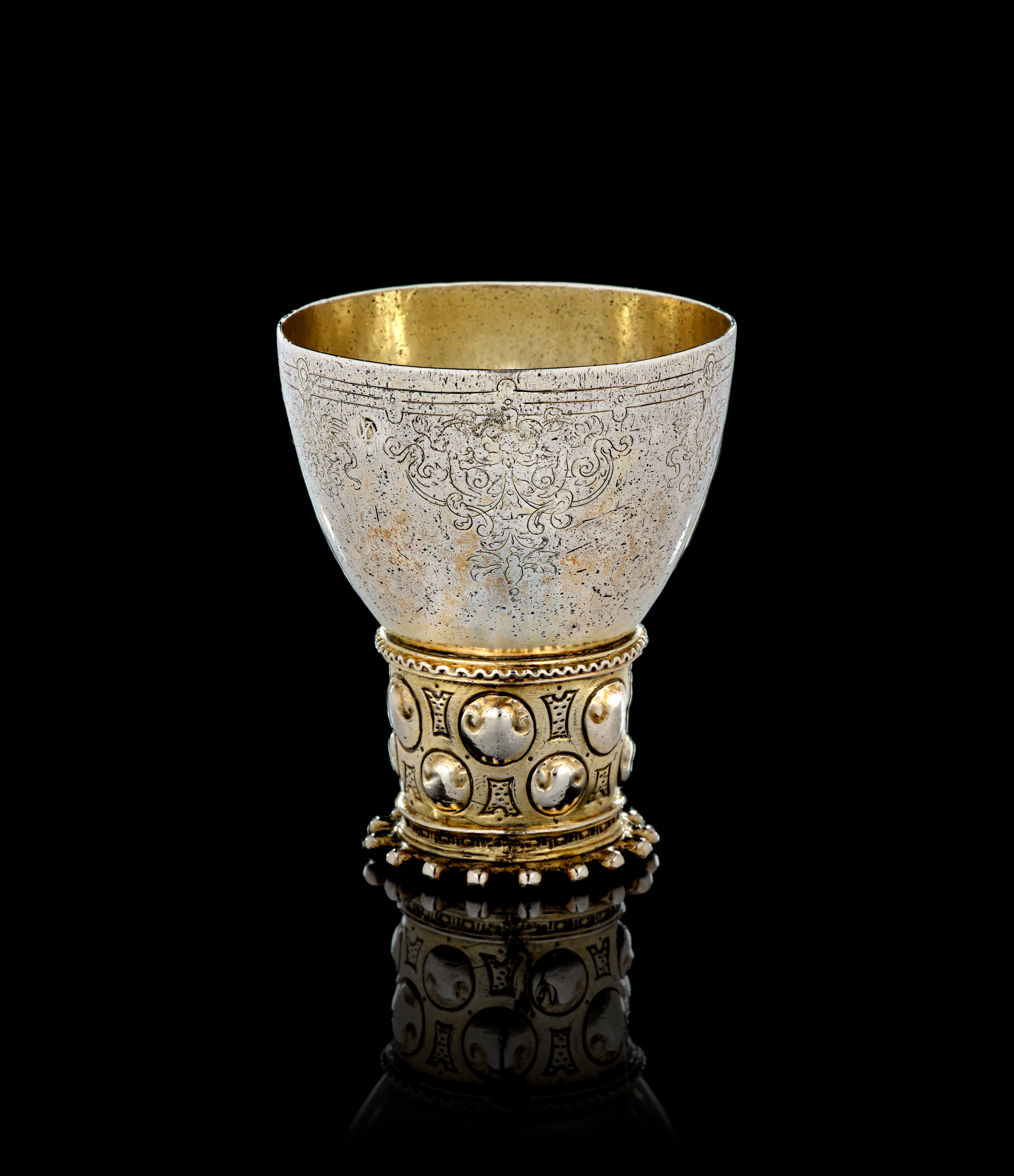 A German parcel-gilt silver römer beaker, Isack de Voeghelaer, Emden, 1610