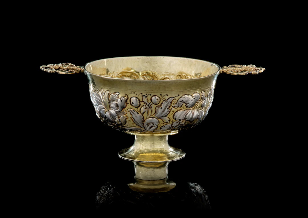 A small German parcel-gilt silver cup with two handles, Andreas Berckmann