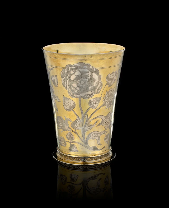 A German parcel-gilt silver beaker with floral motifs, Reinhold Rühl