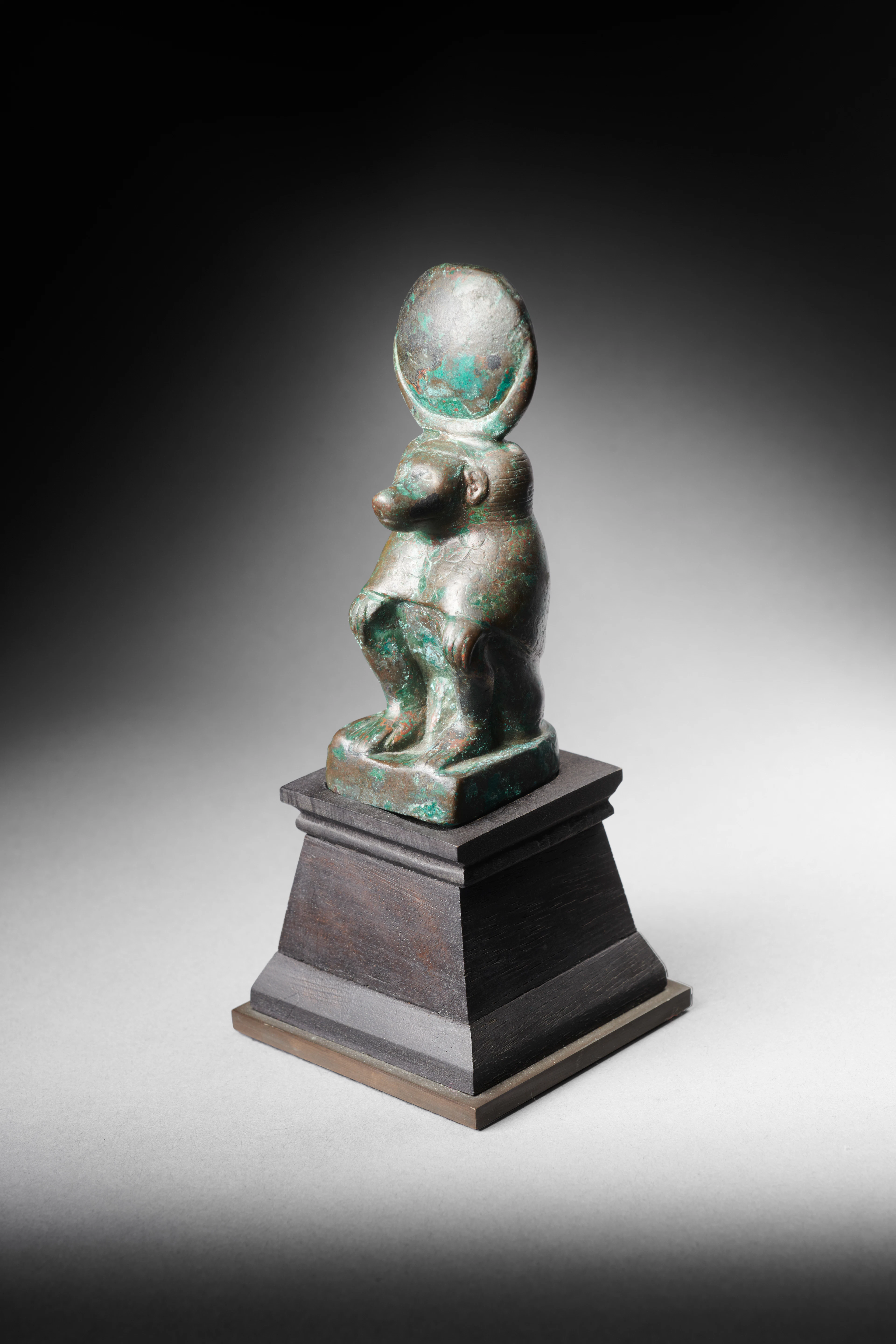 An Egyptian bronze statuette of Thoth as a seated baboon
