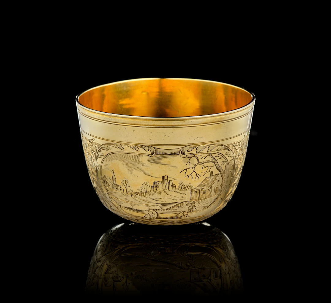 A German silver-gilt tumbler beaker with landscapes, Paul Solanier