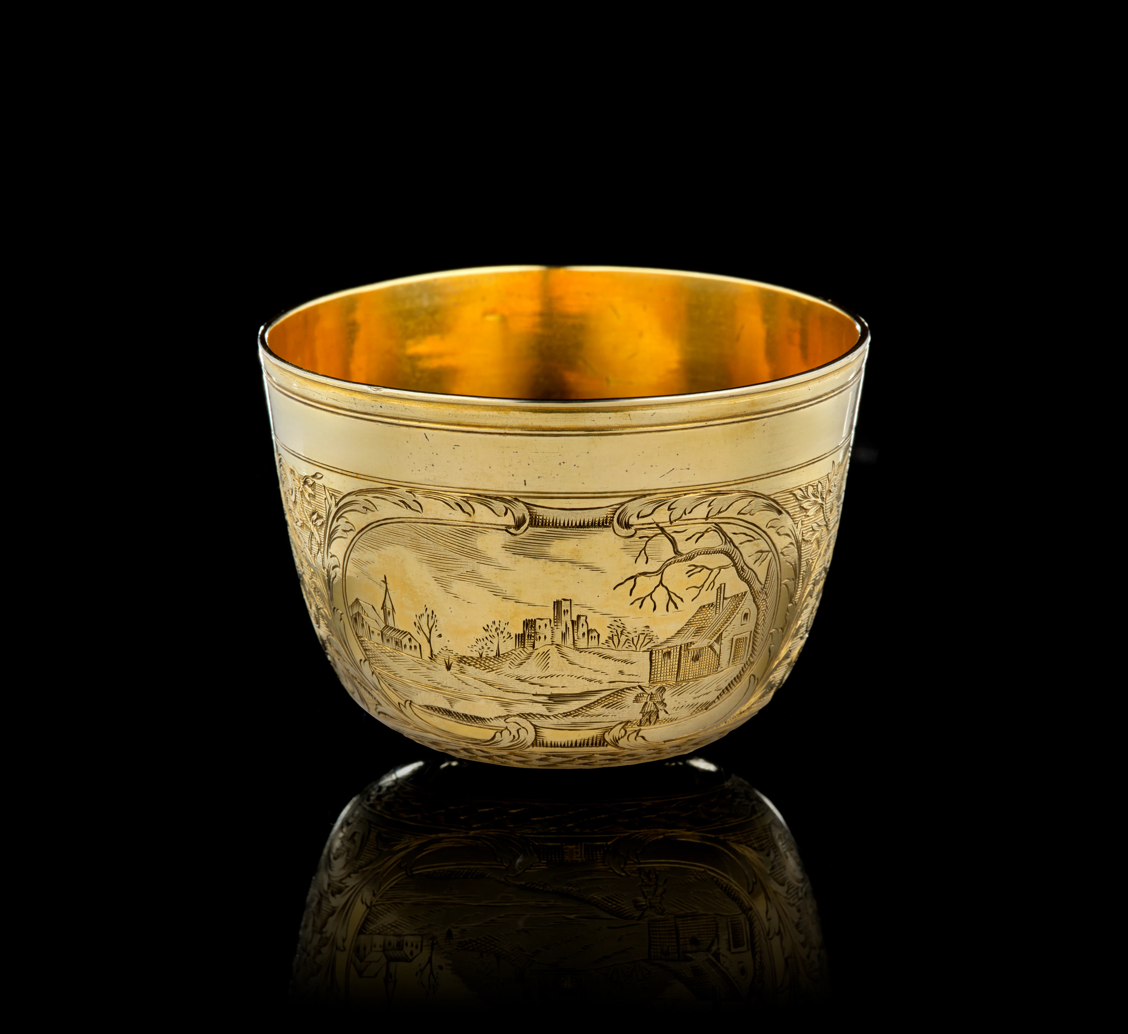 A German silver-gilt tumbler beaker with landscapes, Paul Solanier