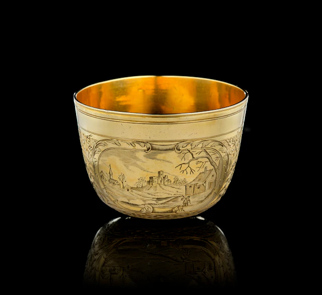 A German silver-gilt tumbler beaker with landscapes, Paul Solanier