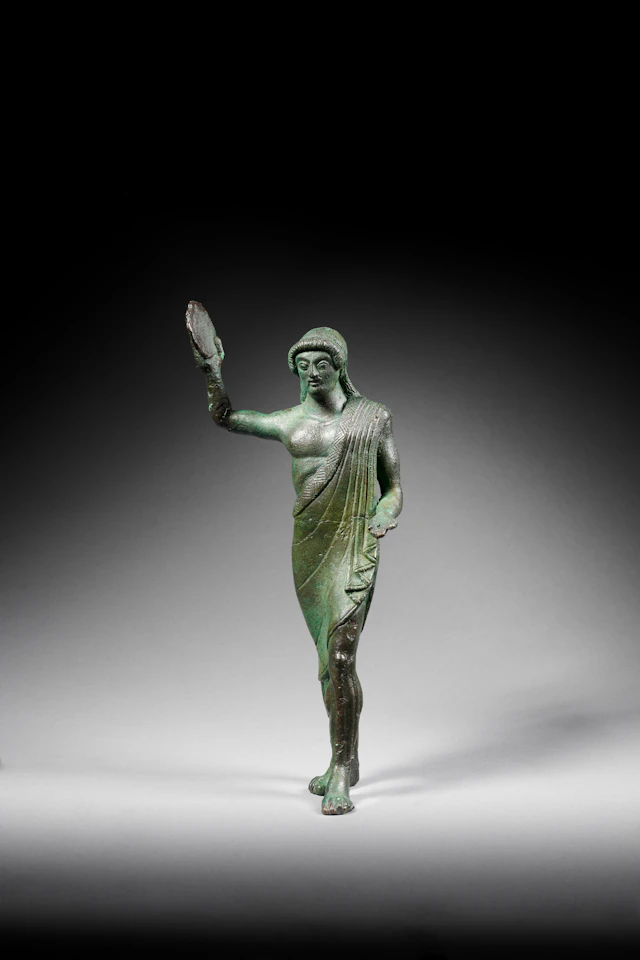 An Etruscan bronze statuette of a man