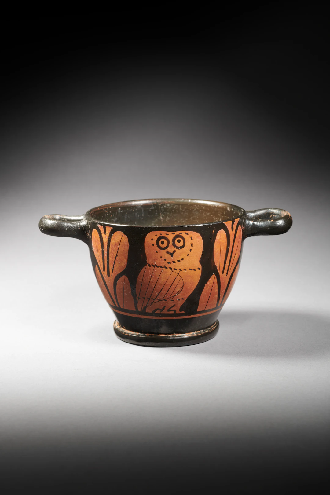 A Greek red-figured skyphos with an owl
