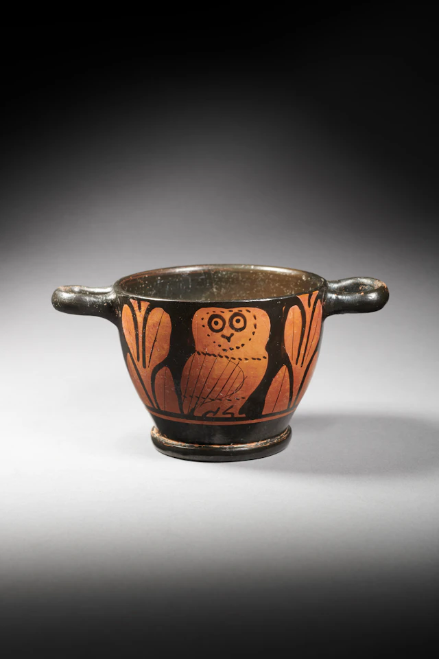 A Greek red-figured skyphos with an owl