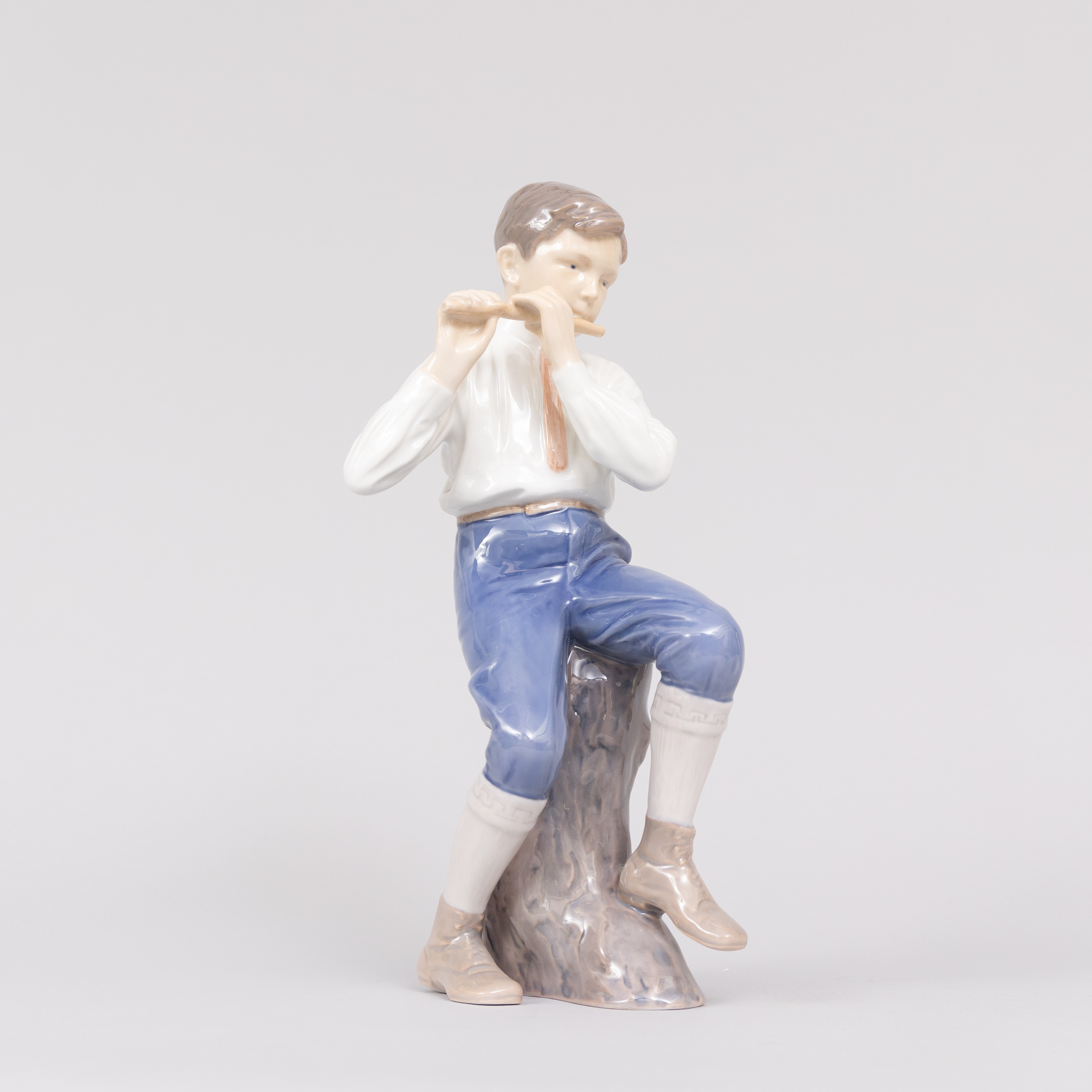 INGEBORG PLOCROSS-IRMINGER (DANMARK 1872-1962). Figurin, Flöjtspelande