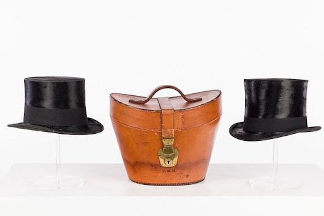 Two Silk Top Hats and a Leather Case