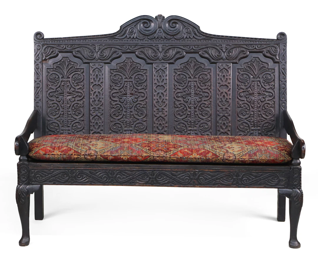 A Charles II Carved Oak Settee