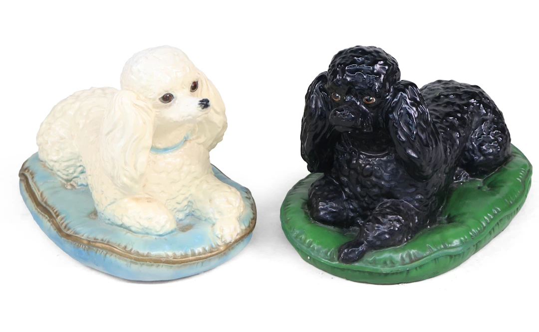 Two Glazed Ceramic Poodles on Pillows