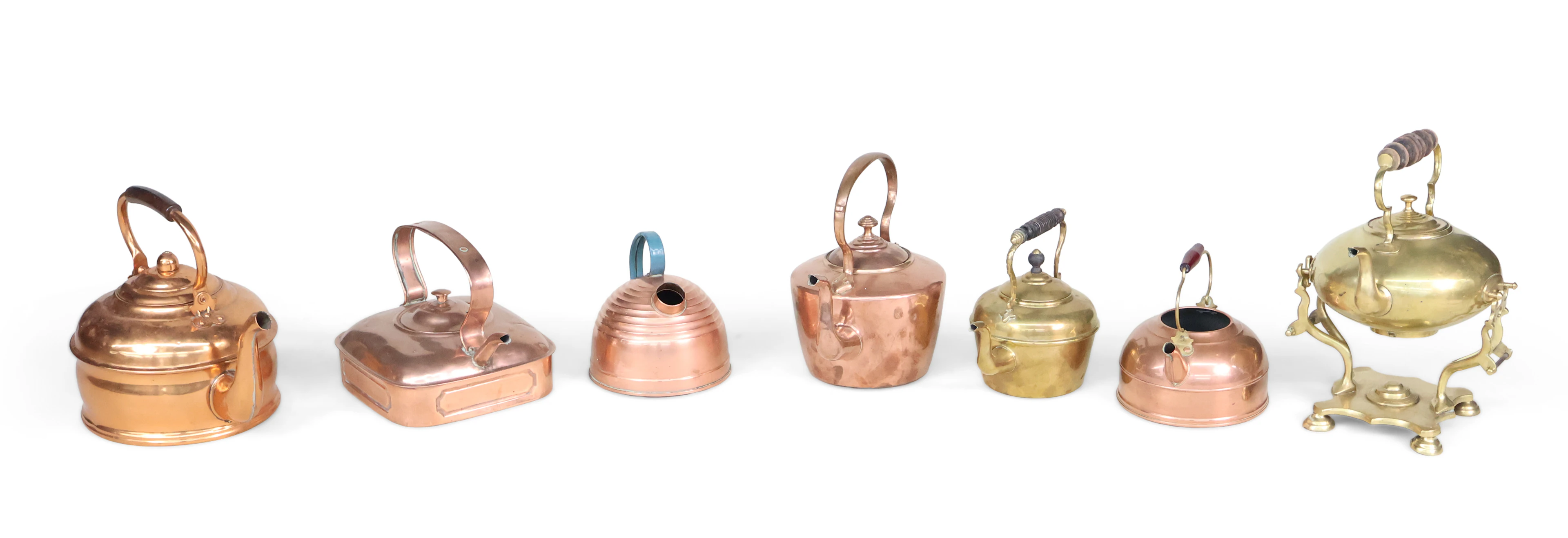 Seven Copper and Brass Kettles