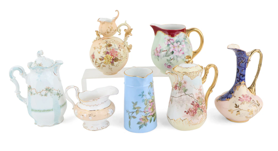 Seven Floral Decorated Porcelain Pitchers