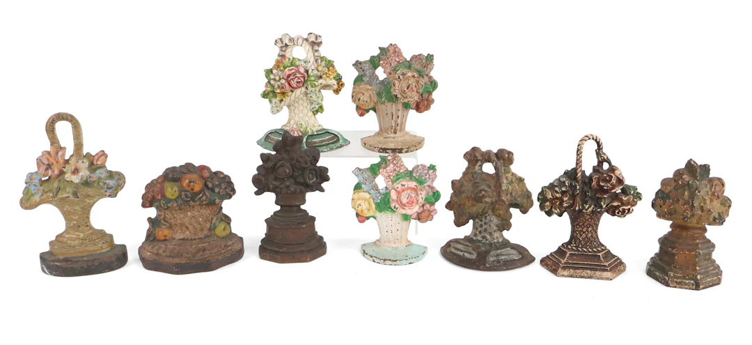 Nine Painted Cast-Iron Flower Basket Doorstops