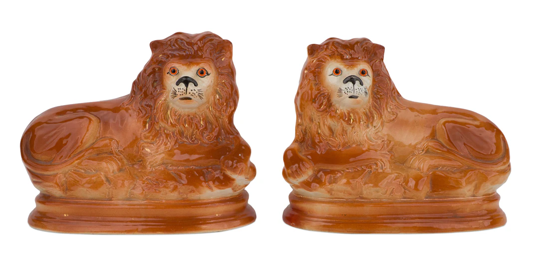 Pair of Staffordshire Reclining Lions