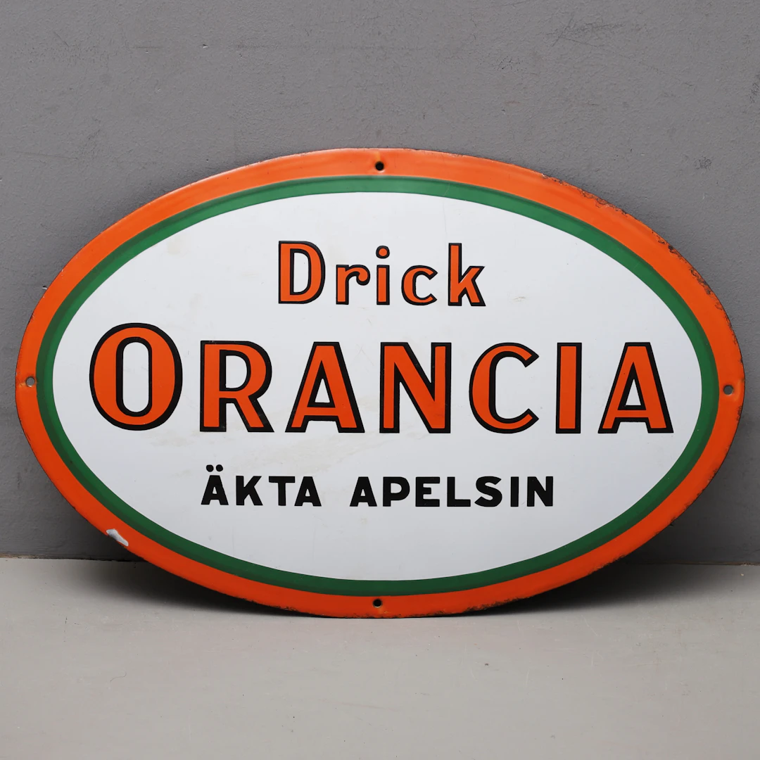 EMALJSKYLT, "Drick ORANCIA äkta apelsin", 1900-talets första hälft.