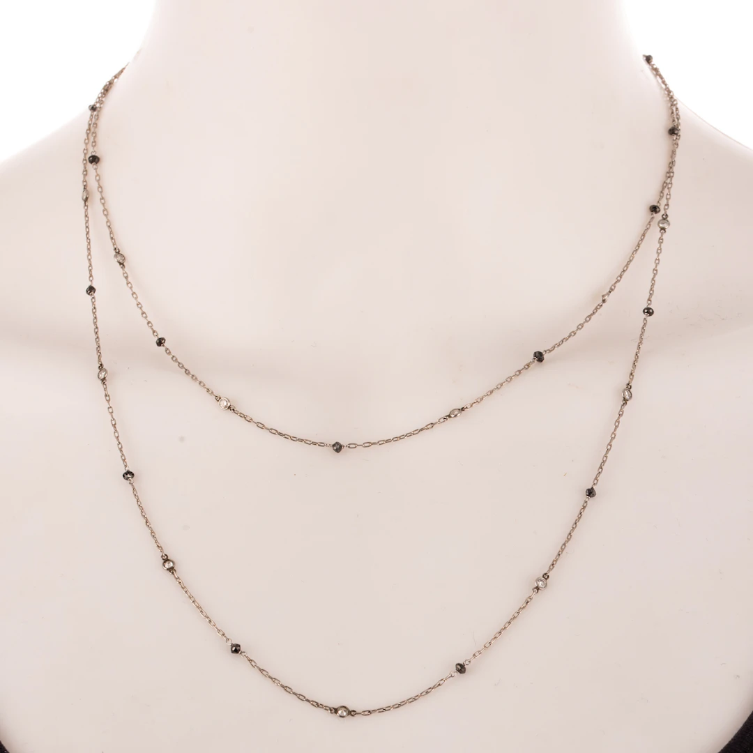 A Black & White Diamond Station Necklace in Platinum