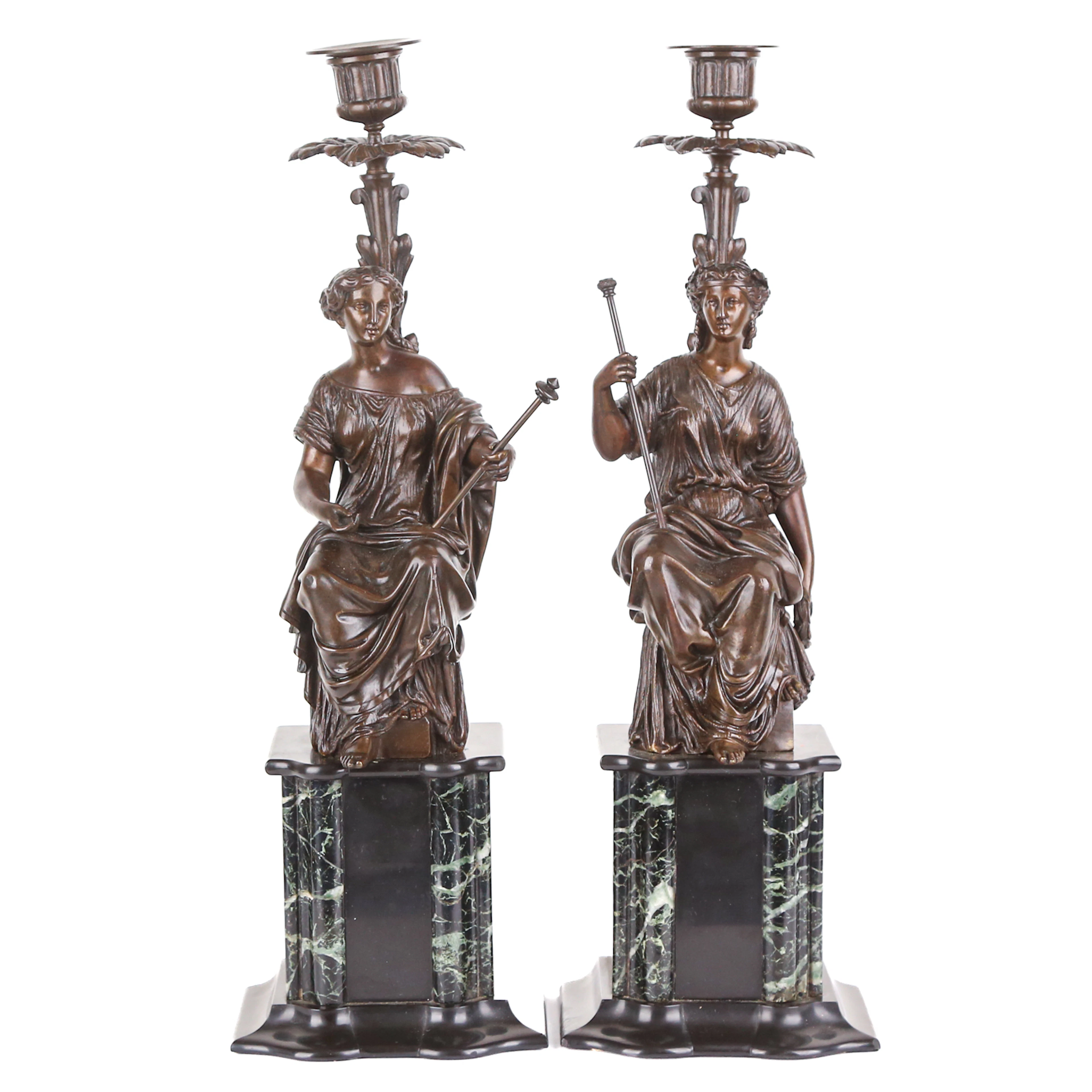 A Pair of Bronze Figural Candlesticks