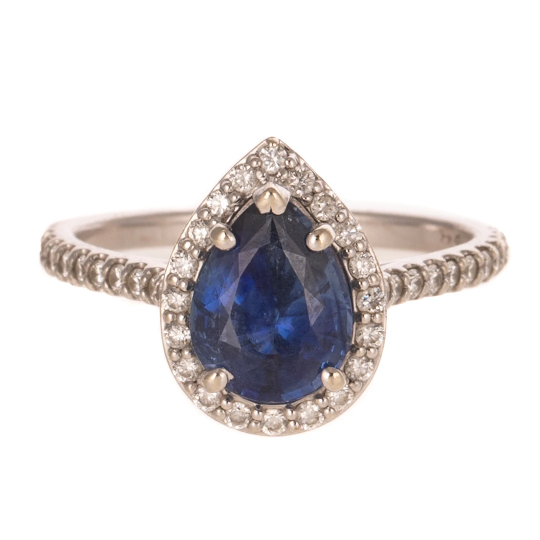 A Tanzanite & Diamond Halo Ring in 14K