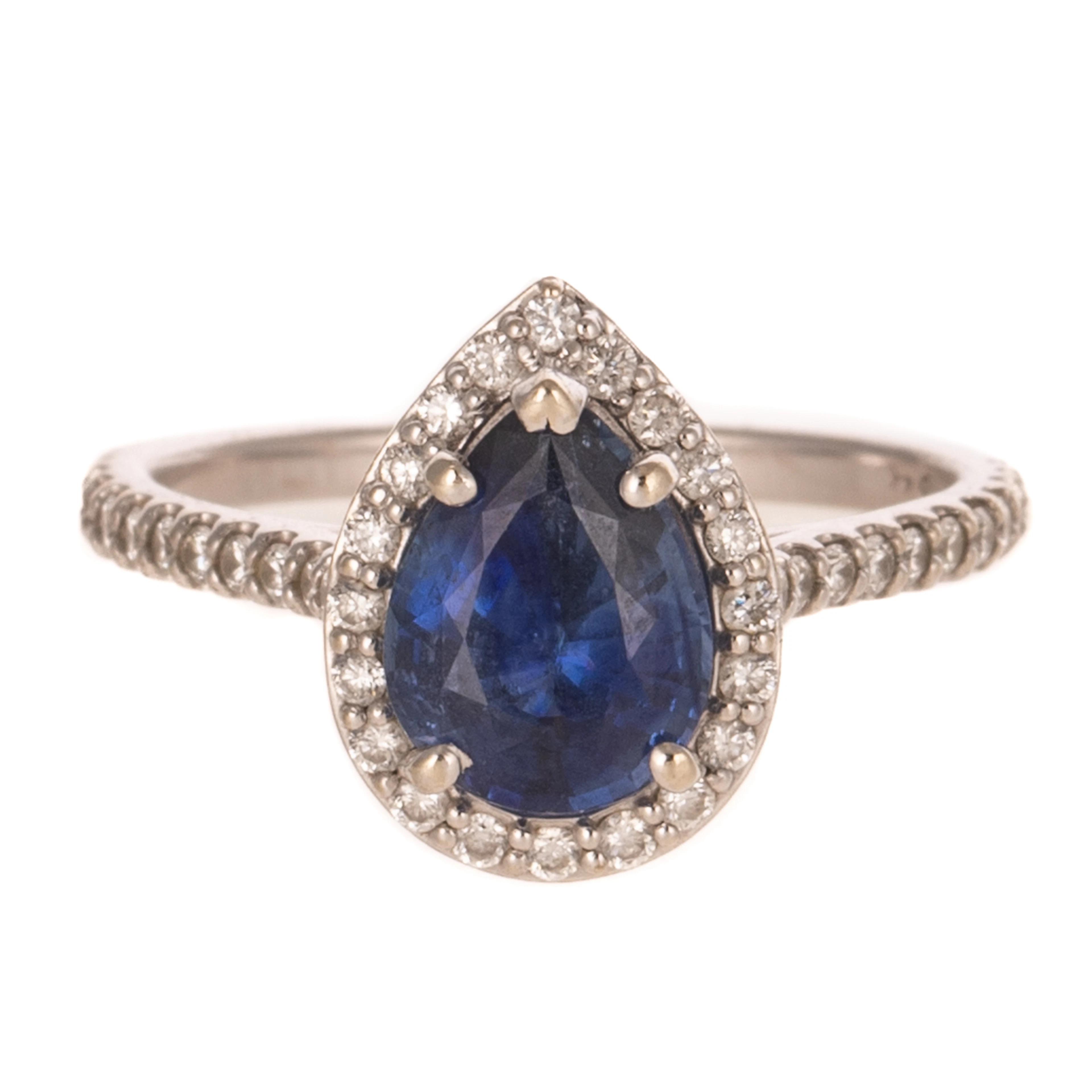 A Tanzanite & Diamond Halo Ring in 14K