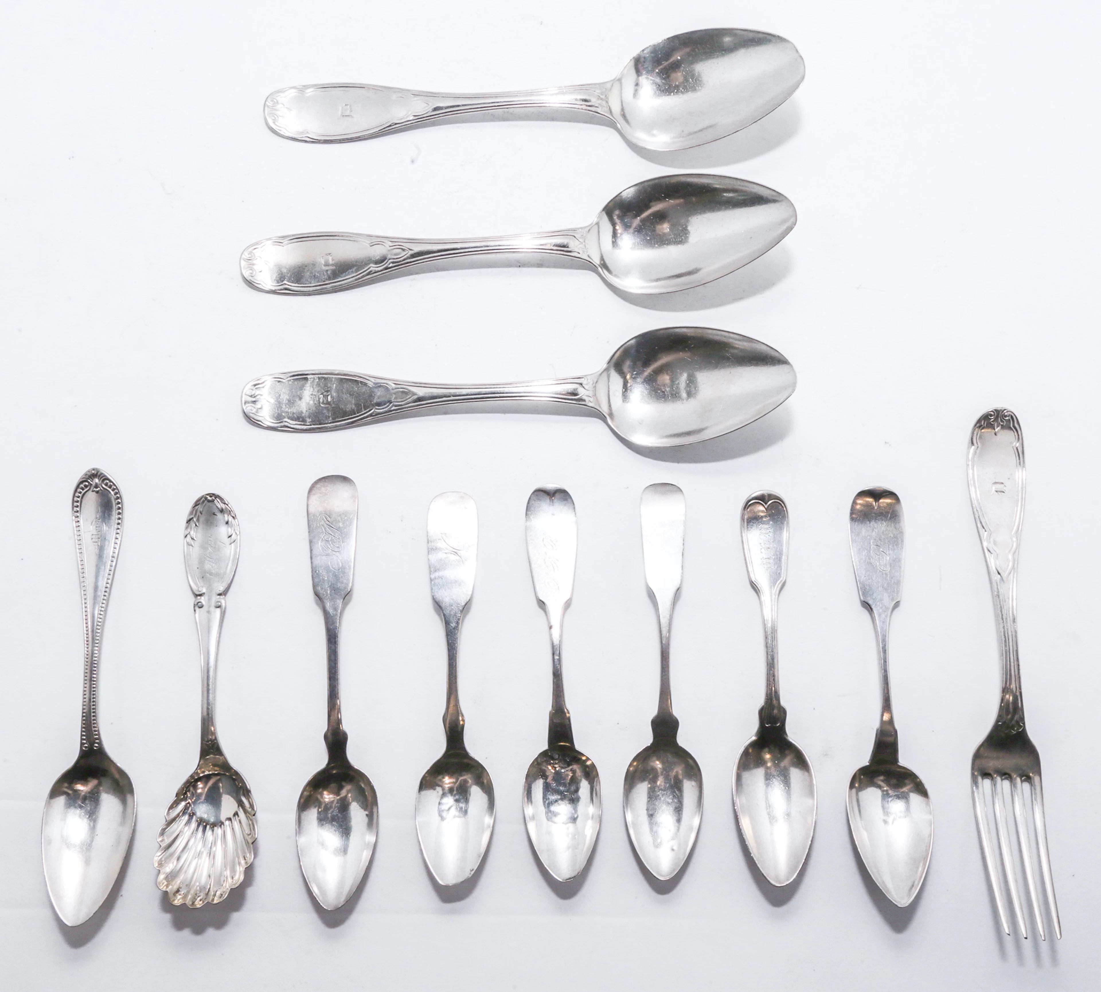11 New York Coin Silver Spoons & One Fork