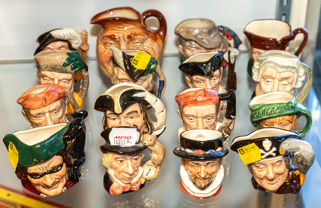 An Assortment of Royal Doulton Character Jugs