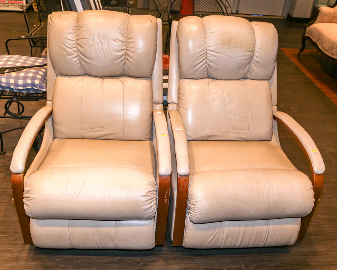 A Pair of Leather-Upholstered Rocking Recliners