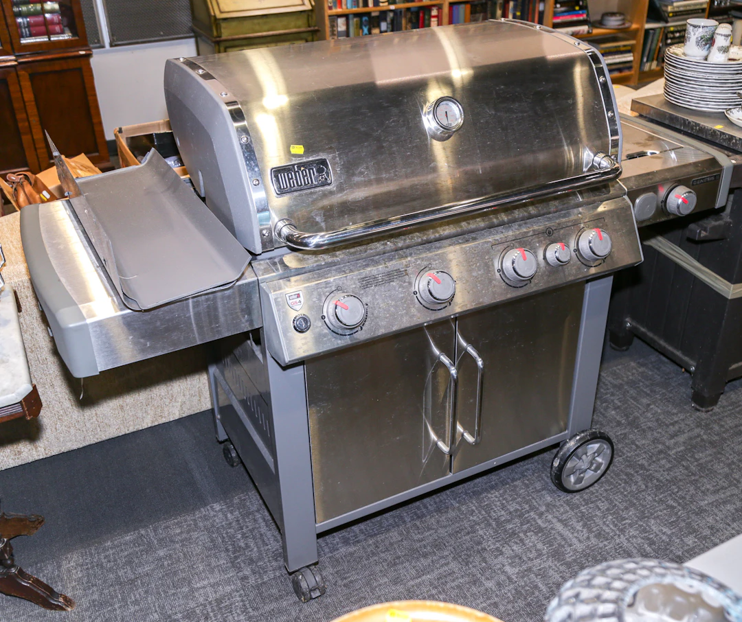 A Weber Genesis II Gas Grill & a Prep Table