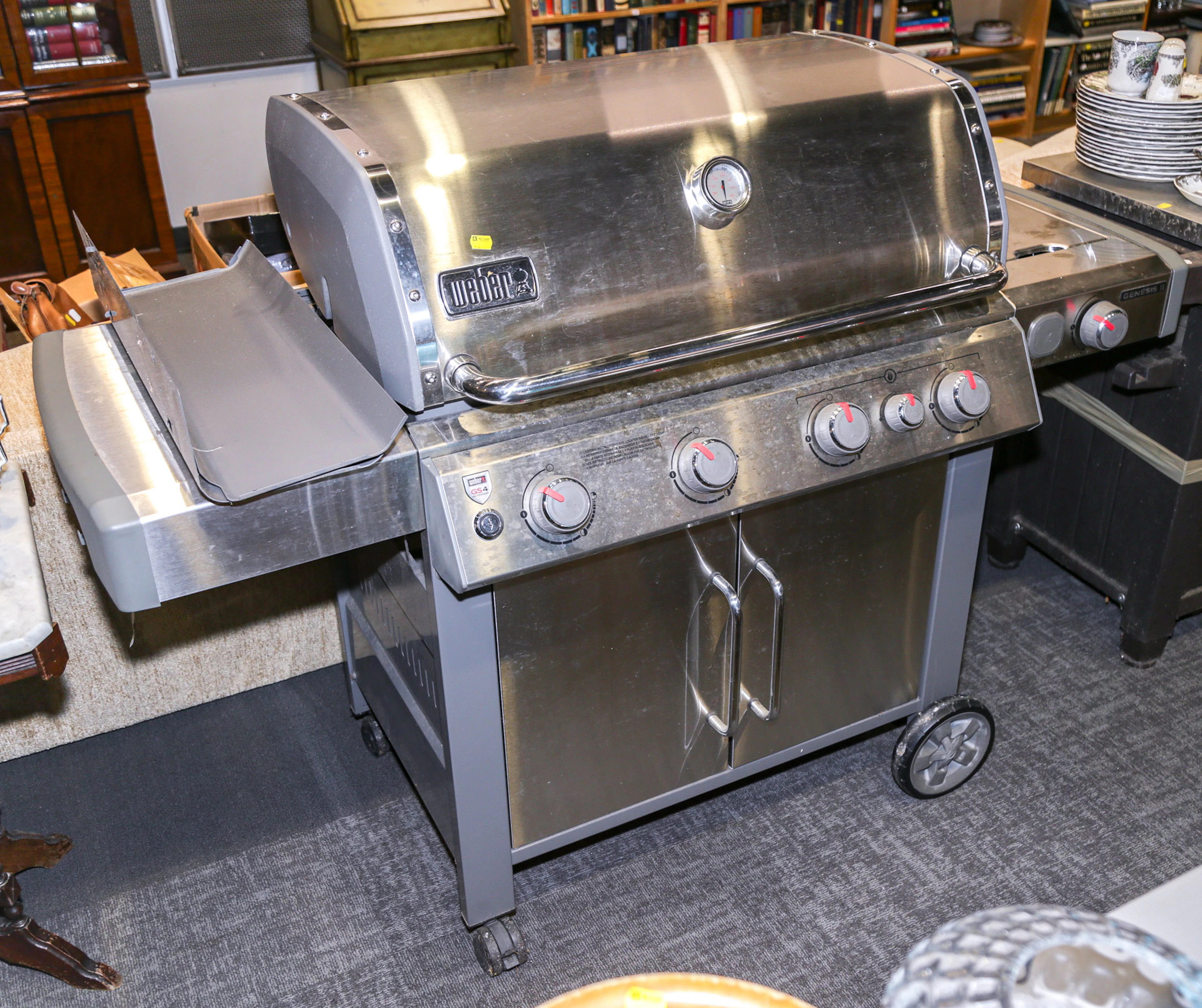 A Weber Genesis II Gas Grill & a Prep Table