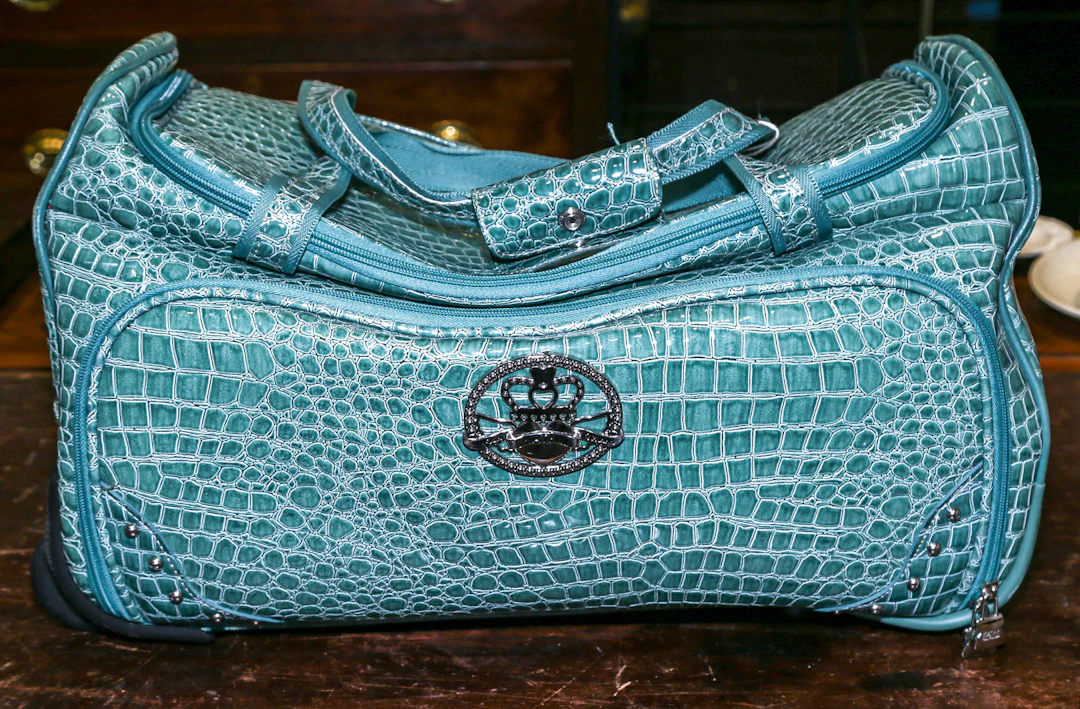 A Kathy Von Zeeland Rolling Duffel Bag