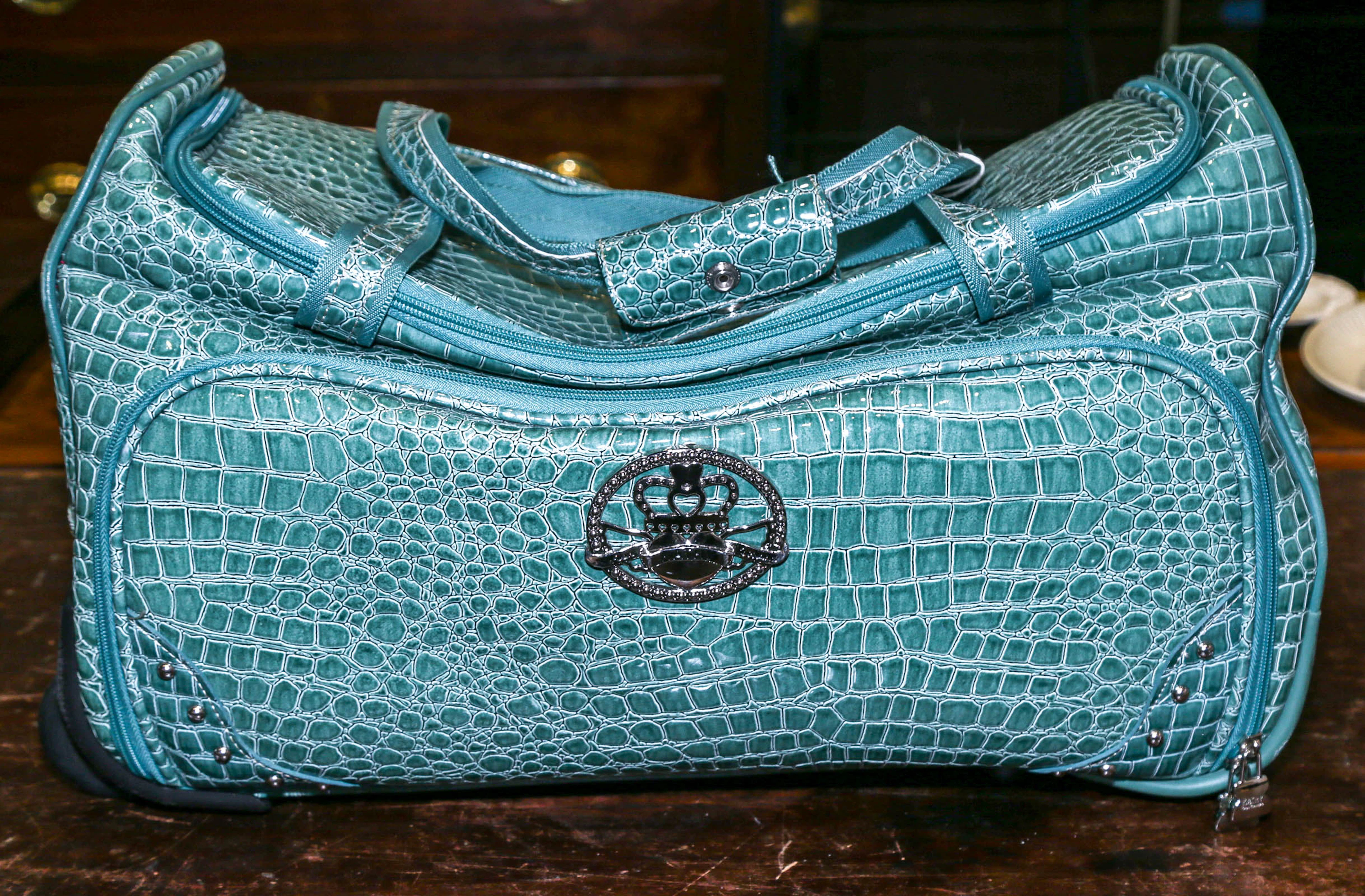 A Kathy Von Zeeland Rolling Duffel Bag