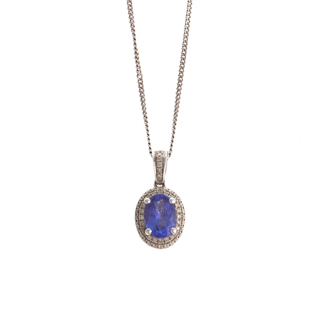 A Tanzanite & Diamond Pendant & Chain in 14K